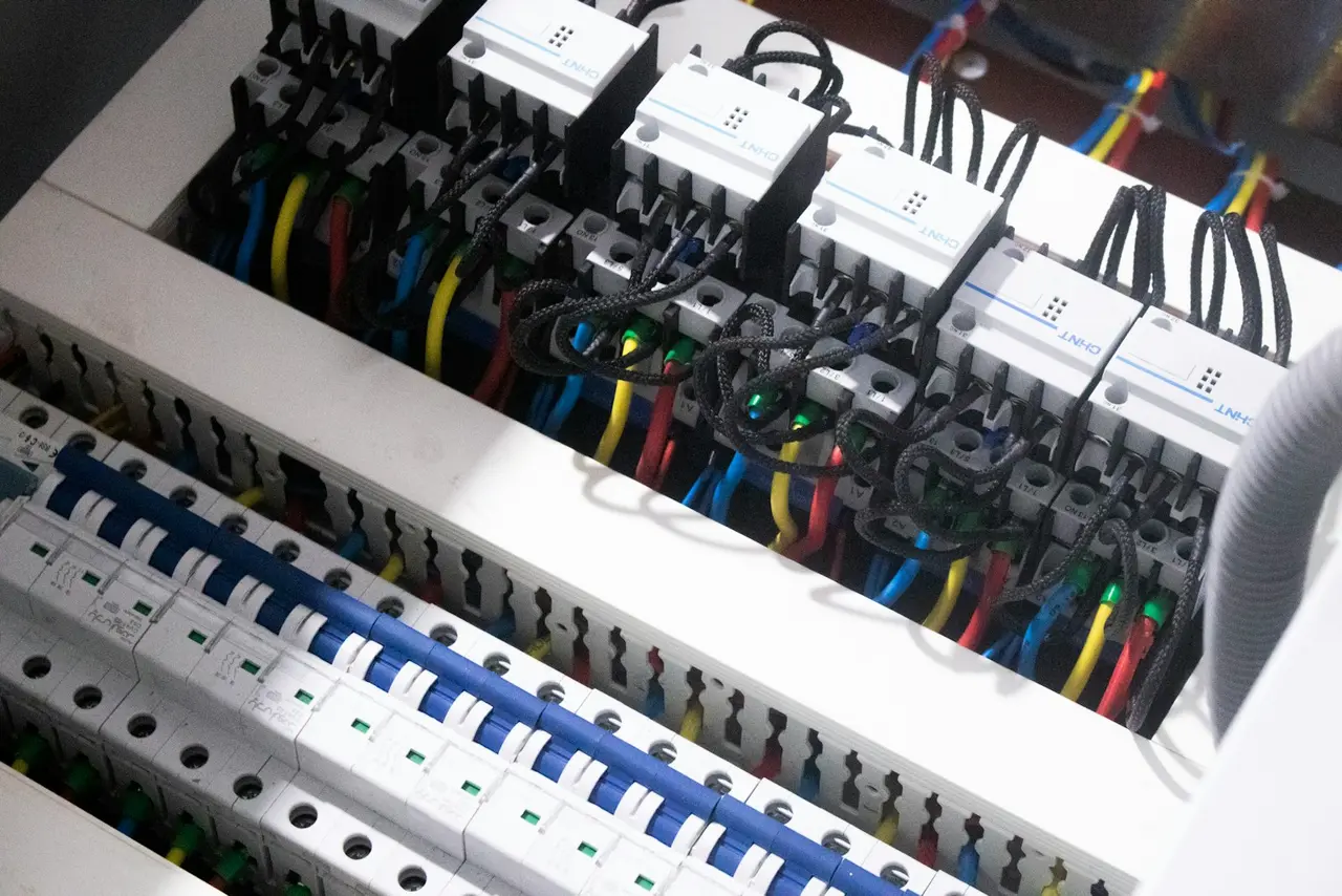 Circuit breakers and control wiring inside an electrical cabinet